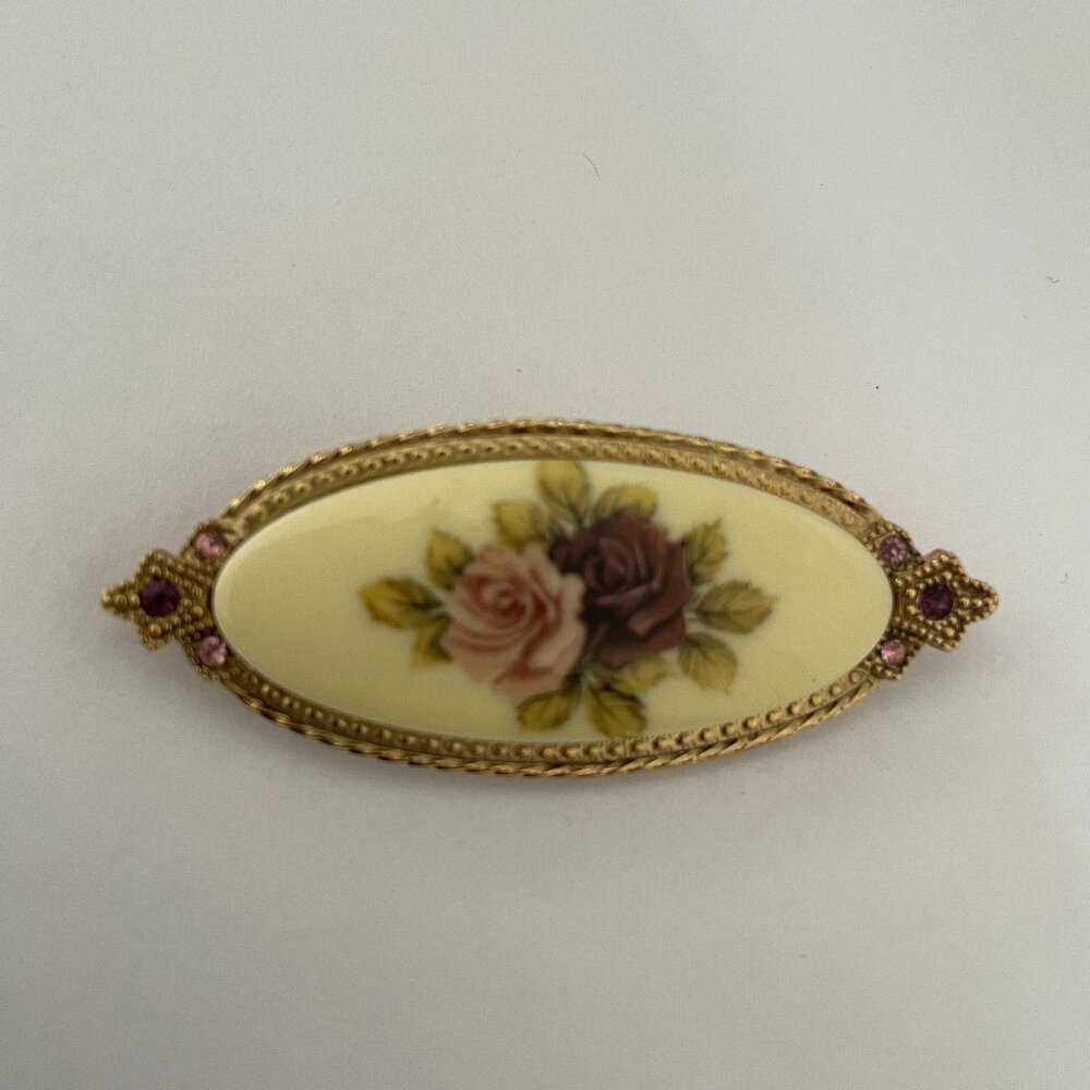 Brooch with pink and purple flowers